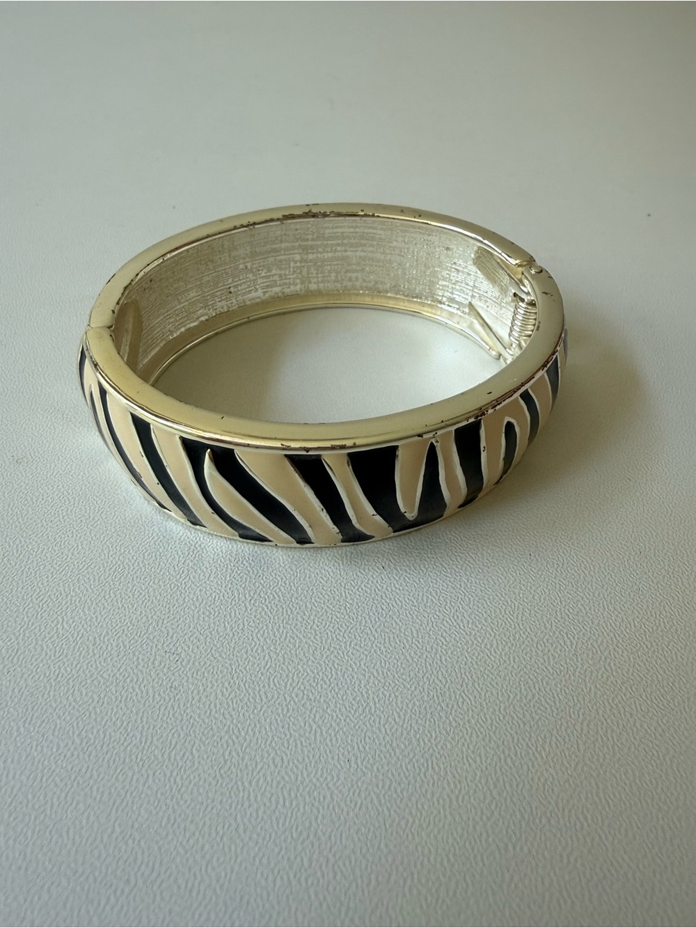 Elegant Zebra-Print Black and Cream Hinged Bangle Bracelet